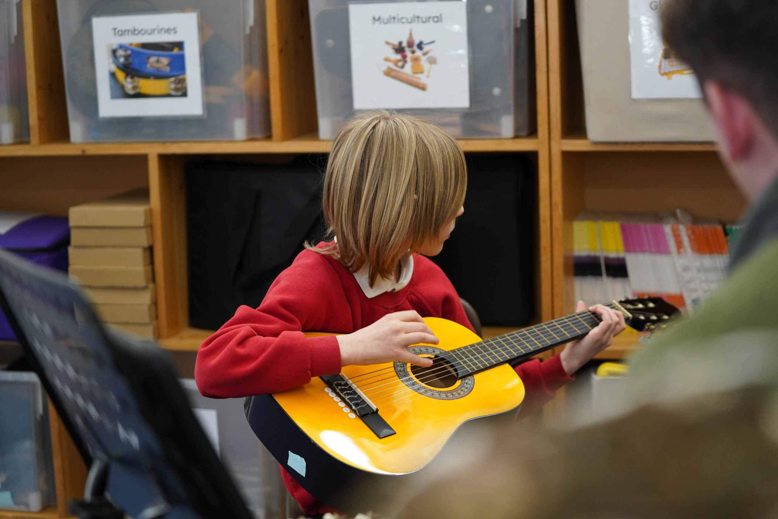 A child playing a guitar